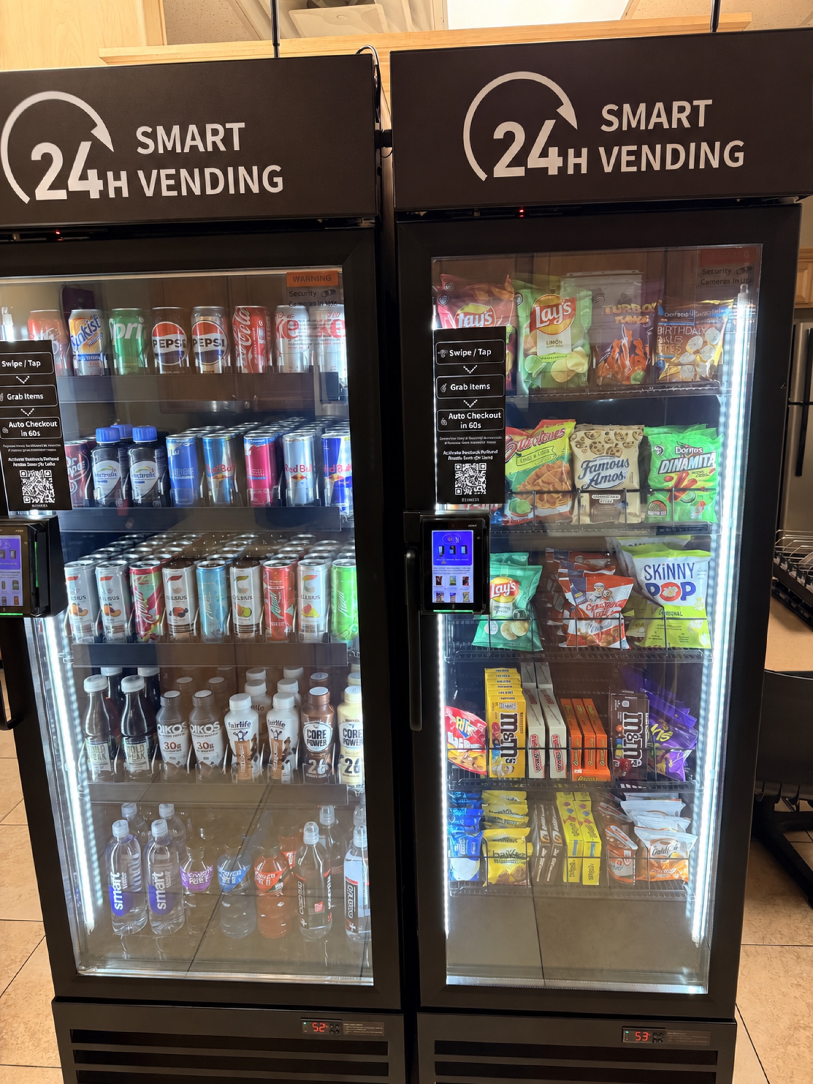 Full view of two stocked smart vending coolers with clear product displays